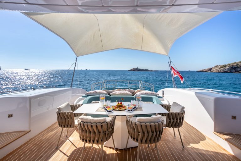 Stern table of Mangusta 108 Belisa - Superyacht in Ibiza