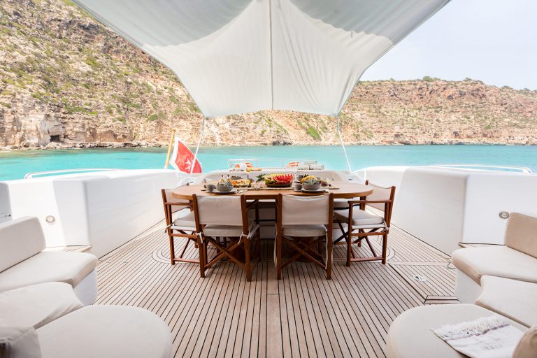 Stern table of Mangusta 108 Nomad - Superyacht in Ibiza