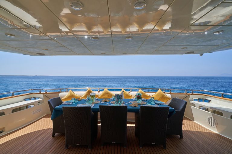 Stern table of Astondoa 102 GLX Kirios - Superyacht in Ibiza